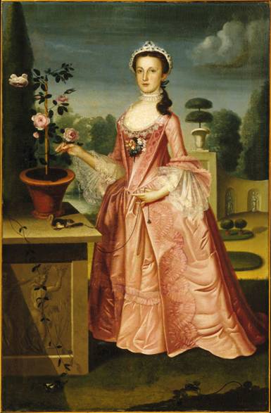 Full length portrait of a young woman in a garden